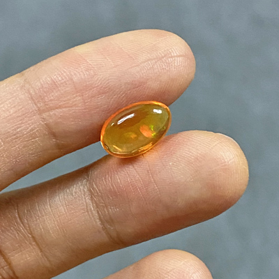 โอปอลไฟ (Fire Opal) จากเม็กซิโก 1.77 กะรัต สีส้ม มีเหลือบเล่นสี