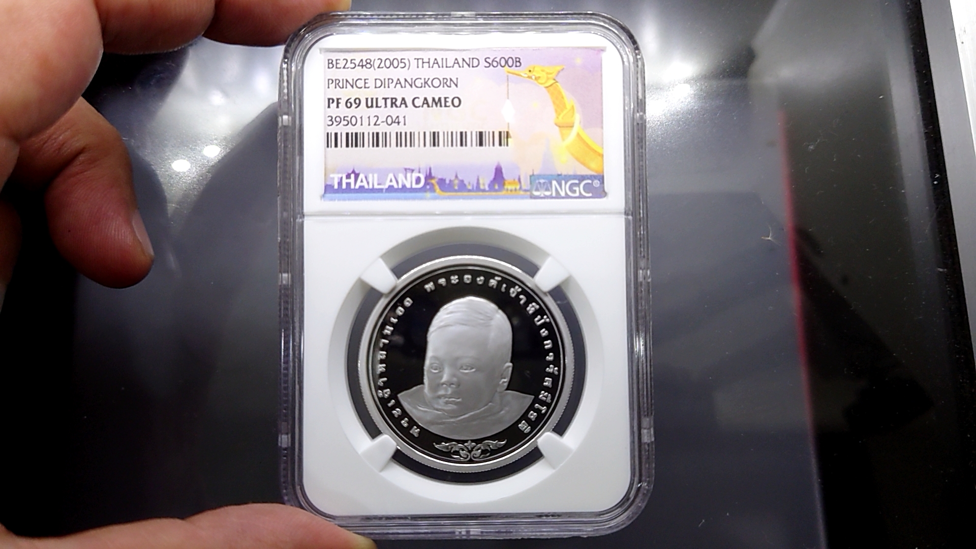 เหรียญเกรดดิ้ง PF 69 เหรียญ 600 บาท สมโภชเดือนและขึ้นพระอุ่ ทีปังกร เงินขัดเงา PF69 ULTRA CAMEO NGC