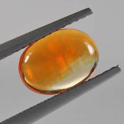 โอปอลไฟ (Fire Opal) จากเม็กซิโก 1.03 กะรัต สีส้ม มีเหลือบไรๆ