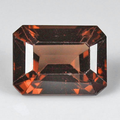 สปิเนลสีส้มน้ำตาลอมแดง (Spinel) 1.56 กะรัต รูปเหลี่ยมมรกต รูปร่างดี