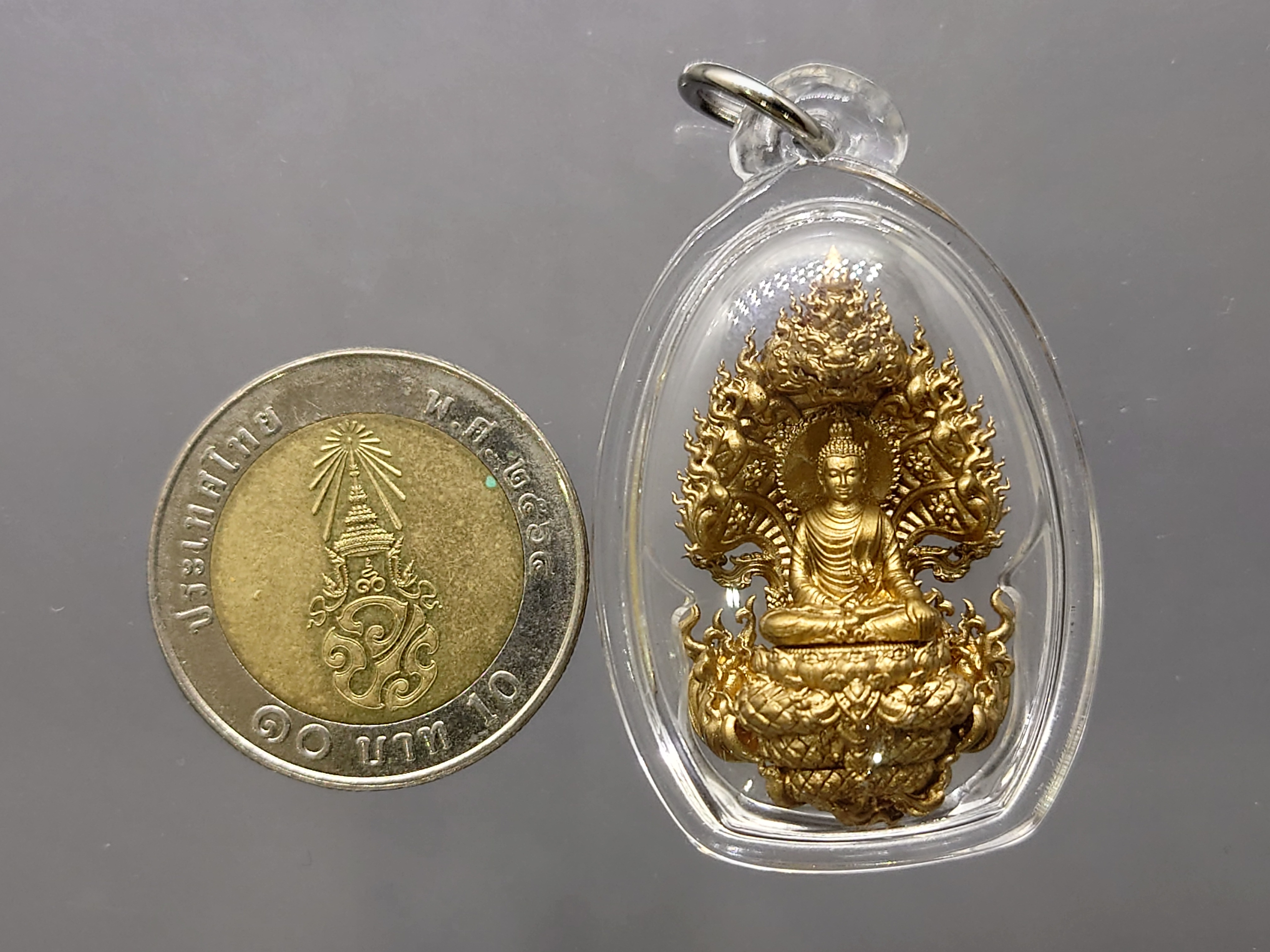 เหรียญหล่อนาคปรกพุทธศิลป พระพุทธสุขนิรันตร์ เนื้อบรอนซ์ พิมพ์เล็ก สร้าง 99 องค์ วัดสิรินธรเทพรัตนาราม พ.ศ.2563 กล่องเดิม