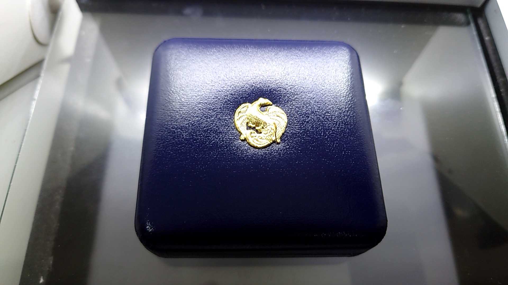 เหรียญนิเกิลขัดเงา 100 บาท การประชุมลูกเสือโลก ครั้งที่33 พร้อมกล่องหนังใบเซอร์