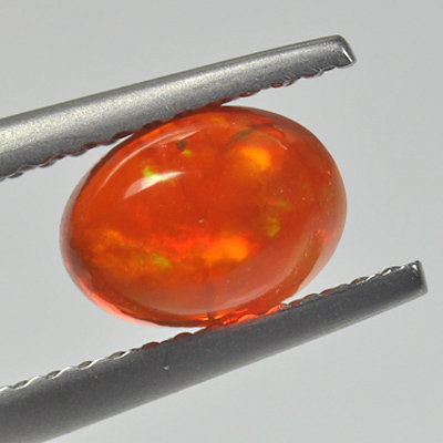 **ขายแล้ว**โอปอลไฟ (Fire Opal) จากเม็กซิโก 1.00 กะรัต สีส้มอมแดง