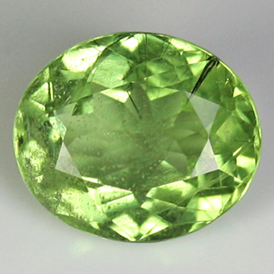 เพอริโด (Peridot) 7.39 กะรัต มีไหมสีดำ เม็ดใหญ่ หายาก จากปากีสถาน