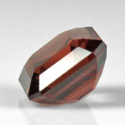 **ขายแล้ว**สปิเนลสีส้มน้ำตาลอมแดง (Spinel) 1.49 กะรัต รูปเหลี่ยมมรกต รูปร่างดี