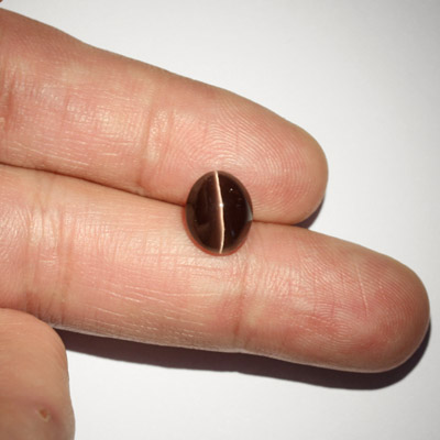 **ขายแล้ว**ซิลลิมาไนท์ตาแมว (Cat's eye Sillimanite) 4.26 กะรัต สีเทา รูปไข่ ตาคม