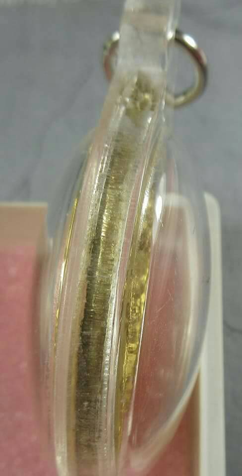 เหรียญคำชะโนด รุ่นแรก เนื้อทองฝาบาตร (พร้อมเลี่ยมกรอบกันน้ำ)