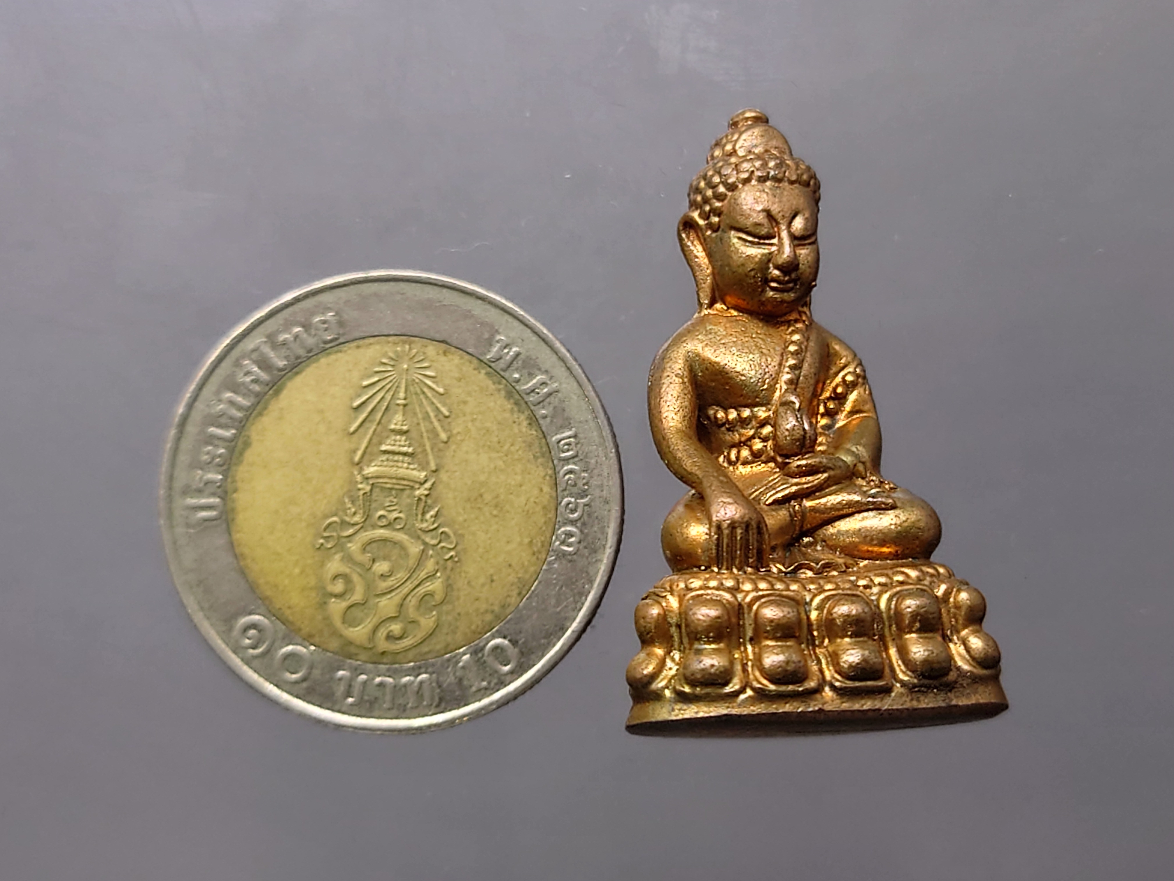 พระกริ่งมงคลประเทศ เนื้อทองแดงโบราณ พิธีมหาพุทธาภิเษก วัดมหาธาตุวรมหาวิหาร จ.นครศรีธรรมราช ปี2553 พร้อมกล่องเดิม