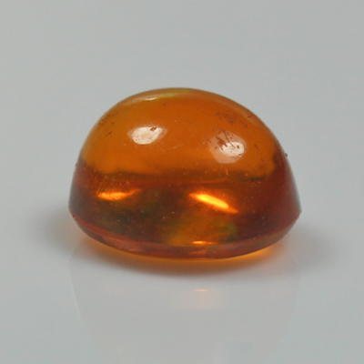 โอปอลไฟ (Fire Opal) จากเม็กซิโก 1.19 กะรัต สีส้ม มีเหลือบสีเขียว