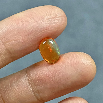 โอปอลไฟ (Fire Opal) จากเม็กซิโก 1.03 กะรัต สีส้ม มีเหลือบไรๆ