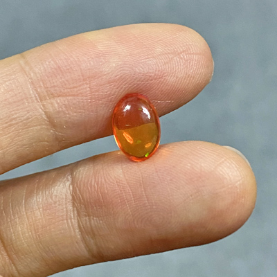 โอปอลไฟ (Fire Opal) จากเม็กซิโก 0.87 กะรัต สีส้ม มีเหลือบอ่อนๆ