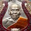 เสือคาบดาบรุ่น 4 เนื้อนวะ ลงยา 3 สี ขอบแดง บนน้ำเงิน ลงยาจีวร (พิมพ์เสือ2) หลวงพ่อพัฒน์ วัดห้วยด้วน โคท 326